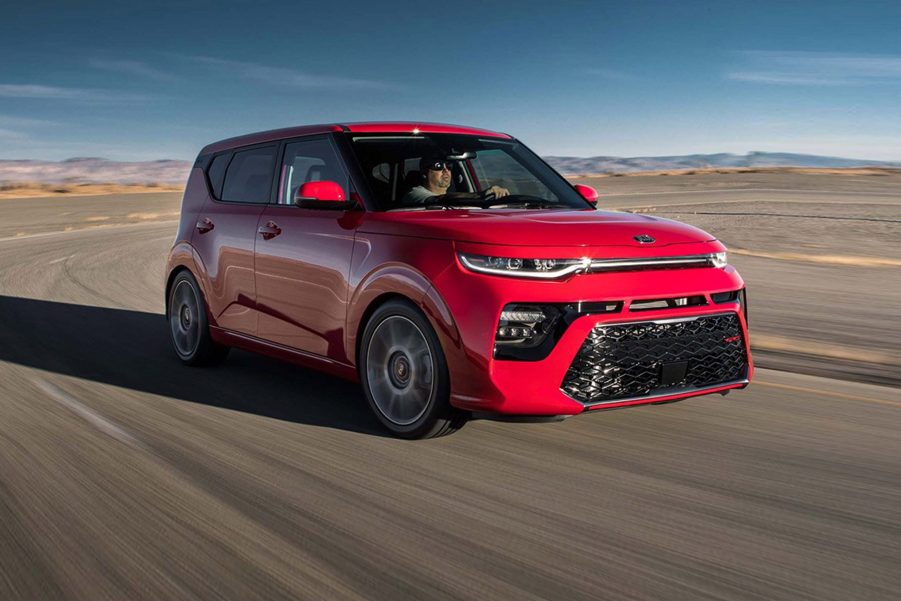 A red 2020 Kia Soul going around a corner