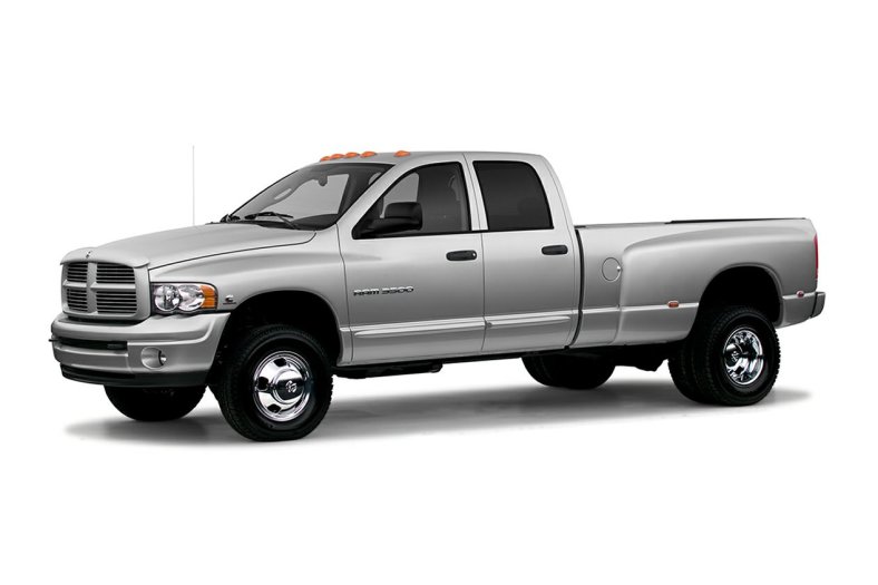 silver 2004 Dodge Ram 3500 heavy duty pickup truck press photo against a white backdrop