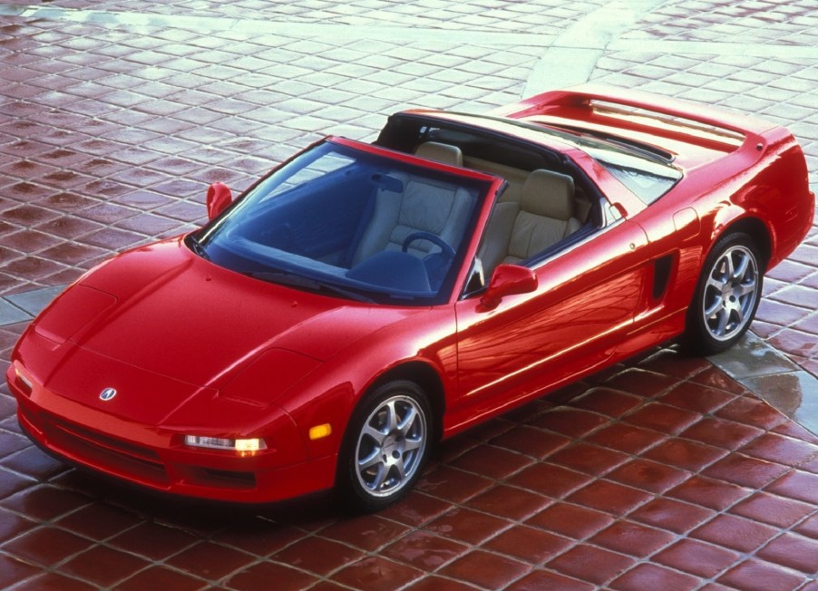 An image of a 1995 Acura NSX in a driveway.