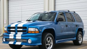 A blue-with-white-stripes 1999 Dodge Durango Shelby SP-360