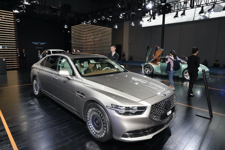 A silver 2020 G90 on display at an auto show