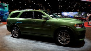 A green 2020 Dodge Durango on display at an auto show