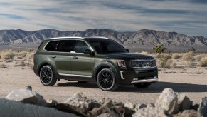 A dark-green 2020 Kia Telluride in the desert