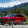 2020 Lexus NX 300h parked near the mountains and lots of trees