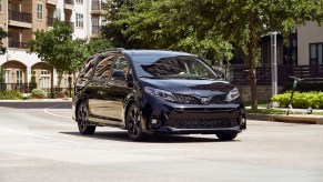 2020 Toyota Sienna driving around apartment buildings