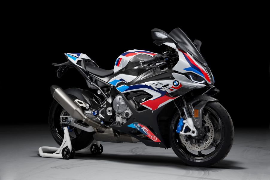 A white-red-and-blue 2021 BMW M 1000 RR on a rear-wheel stand