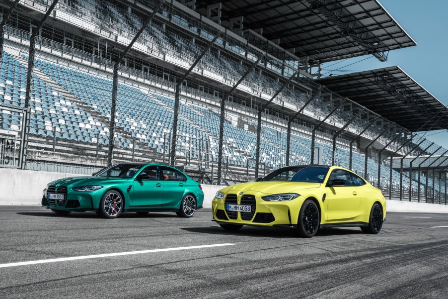 A green 2021 BMW M3 and yellow M3 on a racetrack