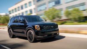 2021 Telluride Nightfall Edition Black driving by an office building