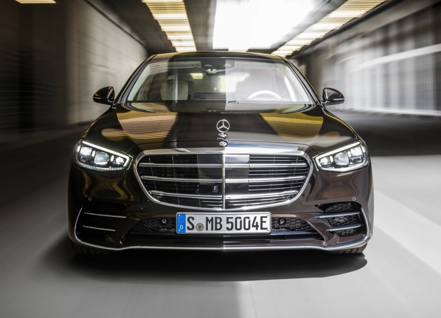 The front of a black 2021 Mercedes-Benz S-Class, showing various sensors and cameras