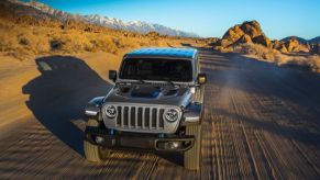 2021 Jeep Wrangler 4xe driving on dirt road