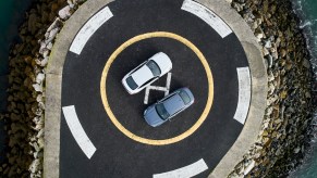 BMW M235i and BMW 220d parked on a helicopter pad