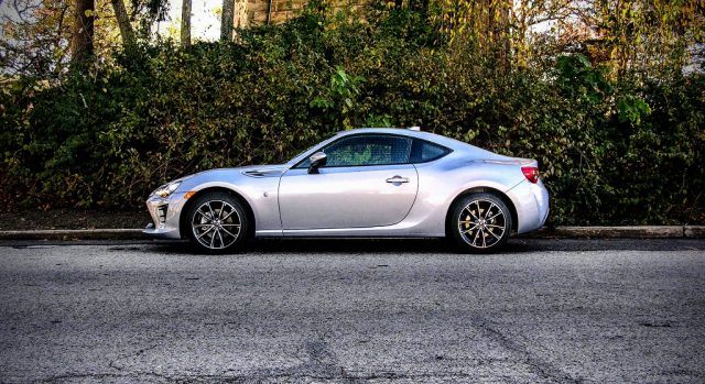 A grey 2017 Toyota 86 parked on a side street.