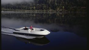 A couple out for a ride on a Bayliner deck boat