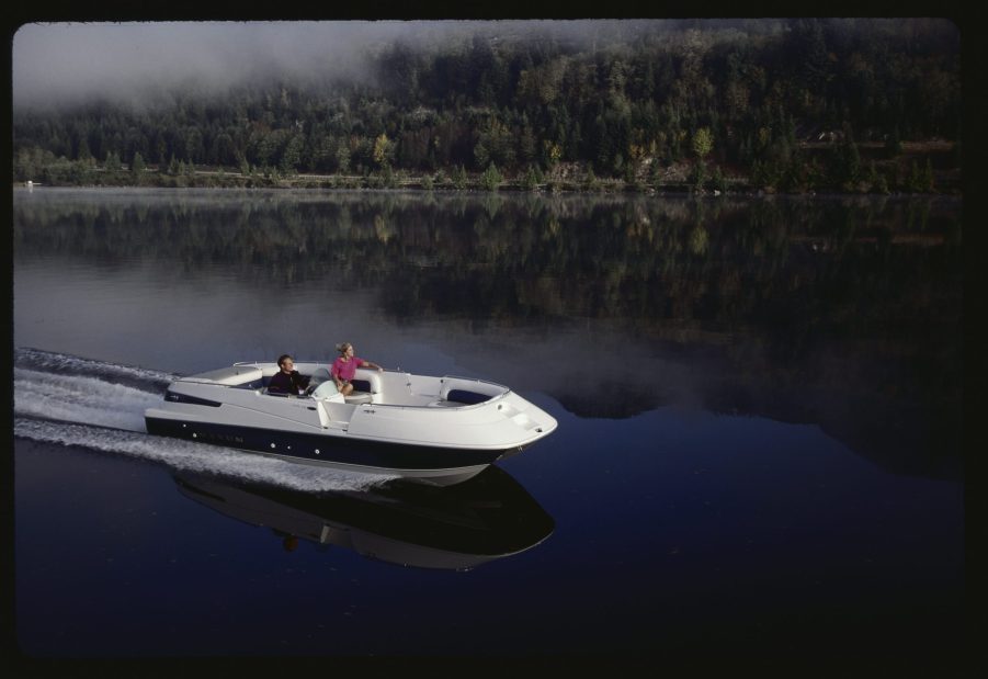 A couple out for a ride on a Bayliner deck boat