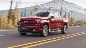 Chevrolet Silverado Diesel driving on a highway near a mountain