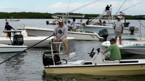 A fishing guide sits on his boat