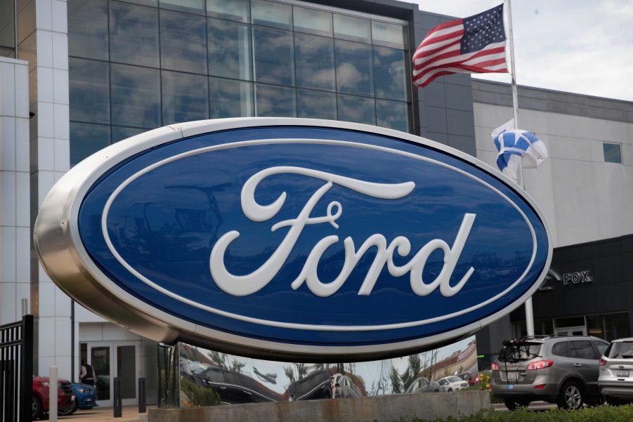 A Ford logo seen on a sign outside of a dealership