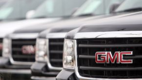 GMC Sierra trucks on display at a dealership