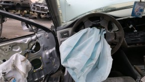 A deployed airbag is seen in a 2001 Honda Accord