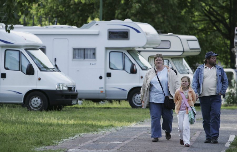 A family walking through an RV park