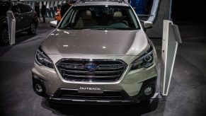 A Subaru Outback on display at an auto show