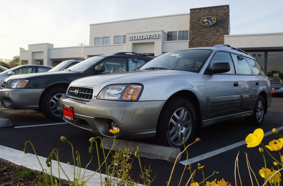 Subaru SUVs on display at a car dealership