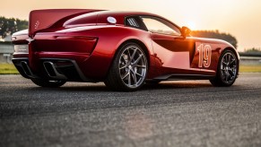 The rear 3/4 of the Touring Superleggera Aero 3 on a racetrack at sunset