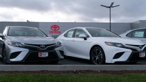 A lineup of Toyota Camry models at a dealership