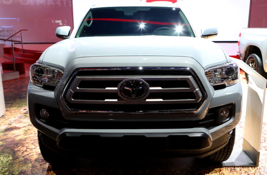 The front grille of a Toyota Tacoma on display at an auto show