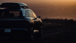 The Lucid SUV, revealed to be called the Lucid Gravity, parked while basking in the sunset