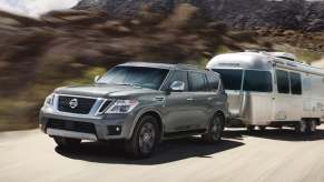 A 2020 gray Nissan Armada towing a trailer.