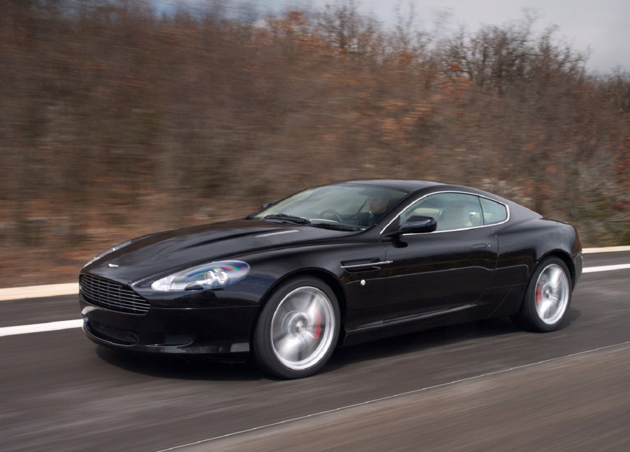 A black 2007 Aston Martin DB9 on a winter road