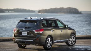 The 2016 Nissan Pathfinder, parked and looking out toward the water.