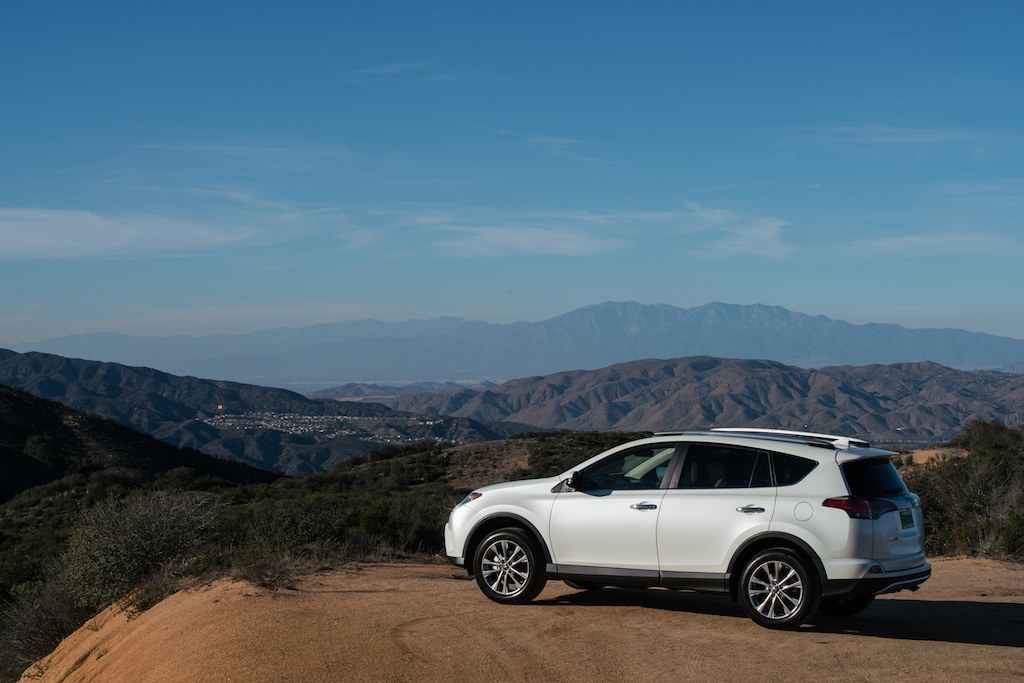 A white 2016 Toyota RAV4 off-road.