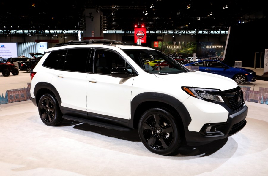 A 2019 Honda Passport on display at an auto show