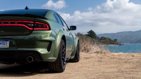 A Green 2020 Dodge Charger facing away toward the water