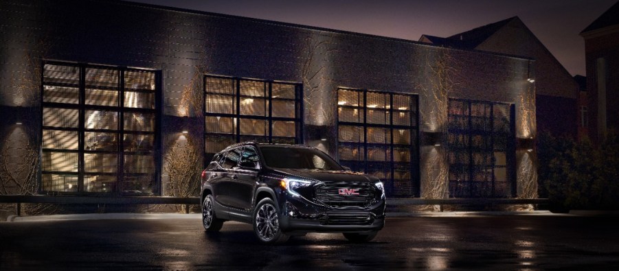 A 2020 GMC Terrain parked in front of several windows