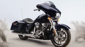 A dark-blue 2020 Harley-Davidson Street Glide parked on a beach