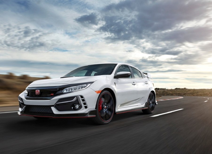 A white 2020 Honda Civic Type R drives down the road