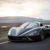 A black 2020 SSC Tuatara on a road with mountains in the background