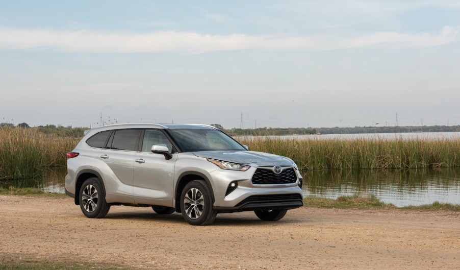 The 2020 Toyota Highlander, surprisingly a competitor to the Acura MDX, parked near a lake