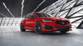 The 2021 Acura TLX Type S on display in front of a futuristic gray and silver background