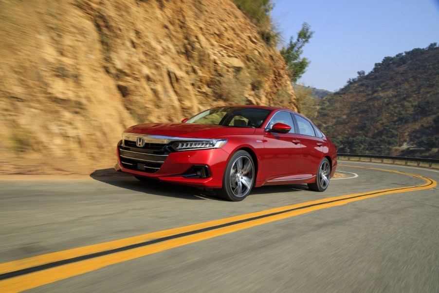 2021 Honda Accord Hybrid driving down a road