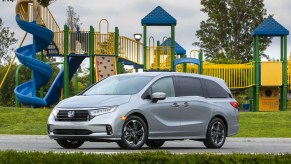 The 2021 Honda Odyssey, a worthy substitute of the Kia Telluride, parked in front of a playground