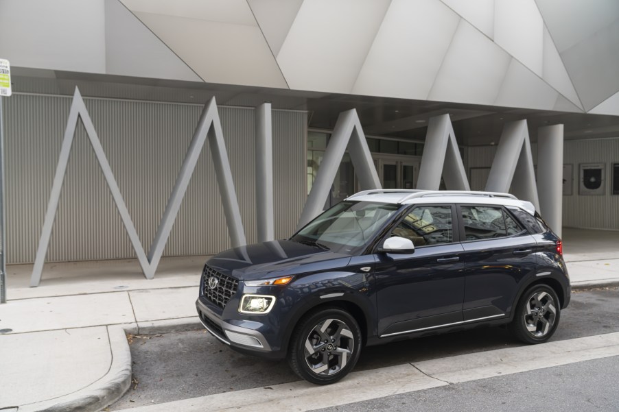 The 2021 Hyundai Venue parked on display in front of a building