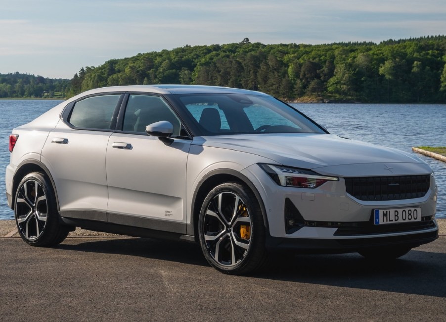 A white 2021 Polestar 2 in front of a body of water