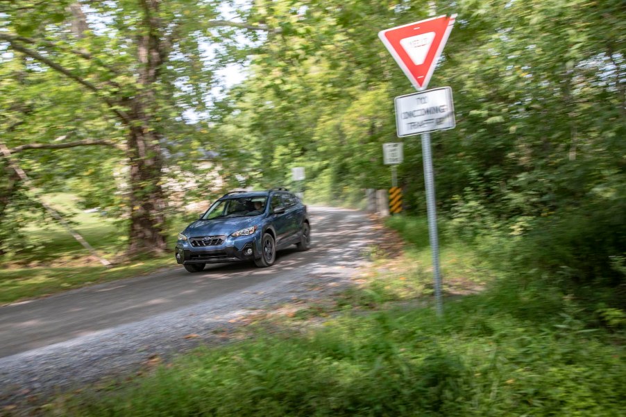 2021 Subaru Crosstrek driving down a street