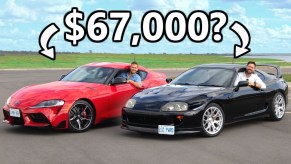 A red 2021 Toyota Supra 3.0 next to a black 1994 Toyota Supra Turbo