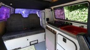 The sink and fridge in a converted Volkswagen T3 camper van