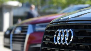 The Audi logo seen on the front grille of an SUV